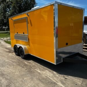 a yellow trailer on a dirt road