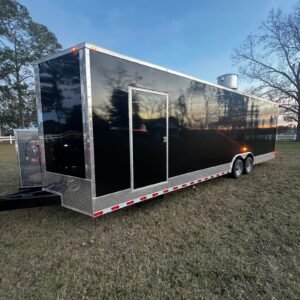 a black trailer with a silver door