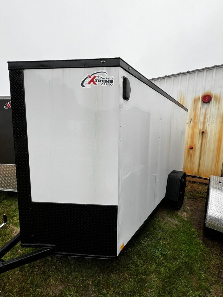 a white trailer with black trim