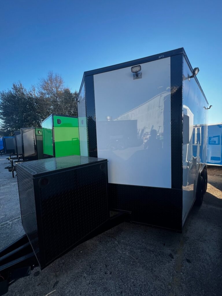 a trailer with a white box and a black box