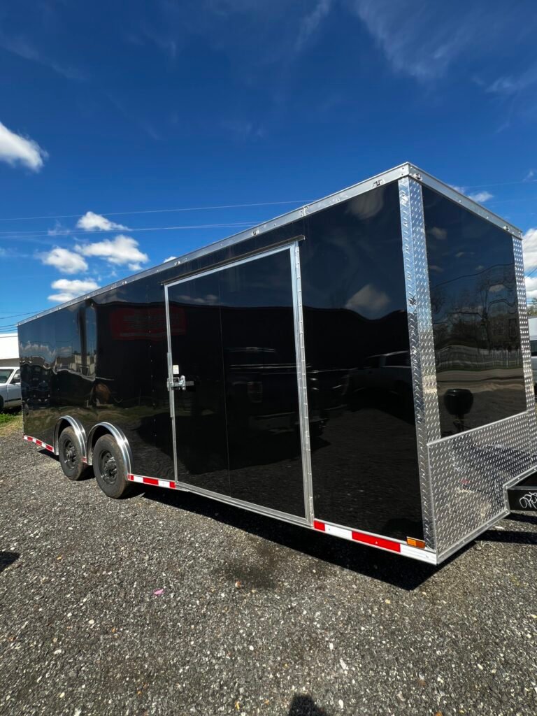 a black trailer with a silver door