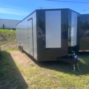 a black trailer with a white stripe on it